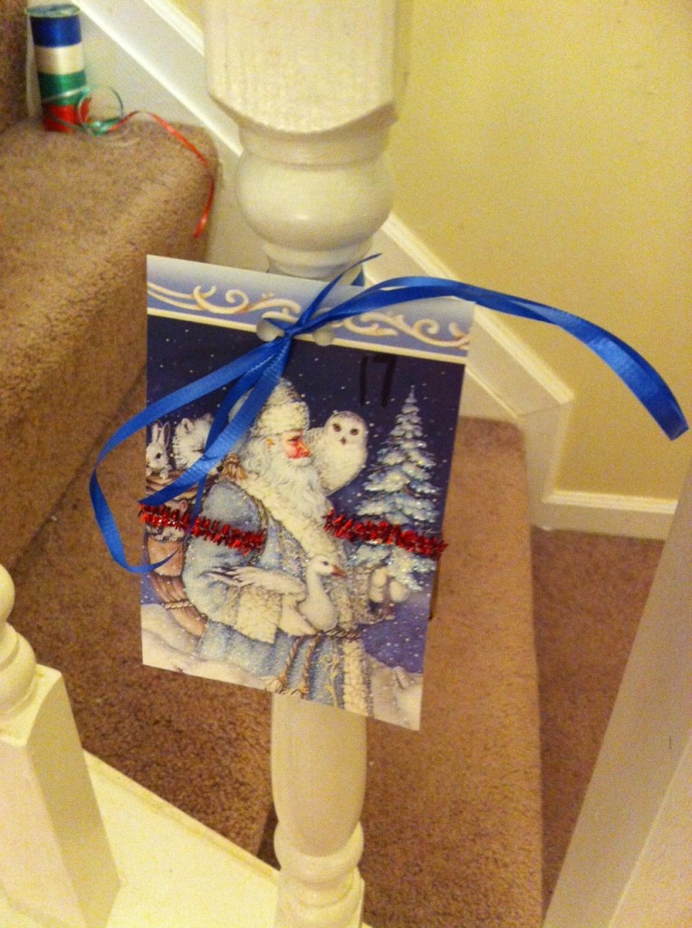 Christmas card advent countdown, individual cards tied to spindlees 